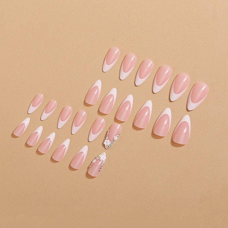 Artificial nails with elegant French tips and rhinestone details Kalsten