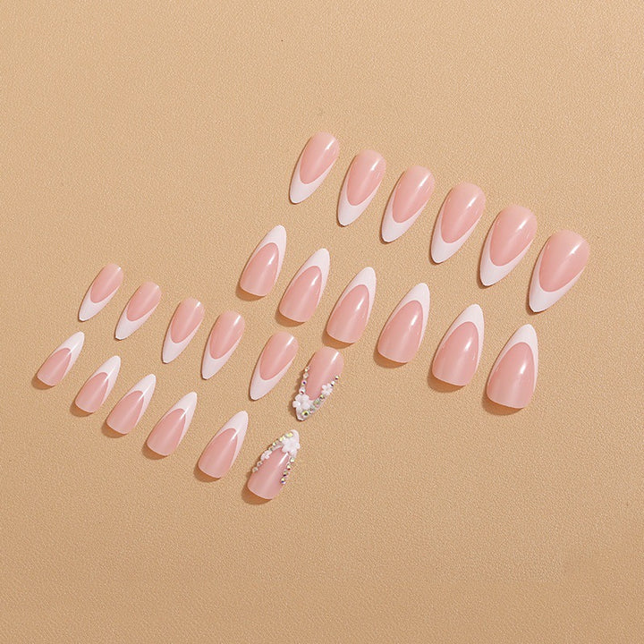 Artificial nails with elegant French tips and rhinestone details Kalsten