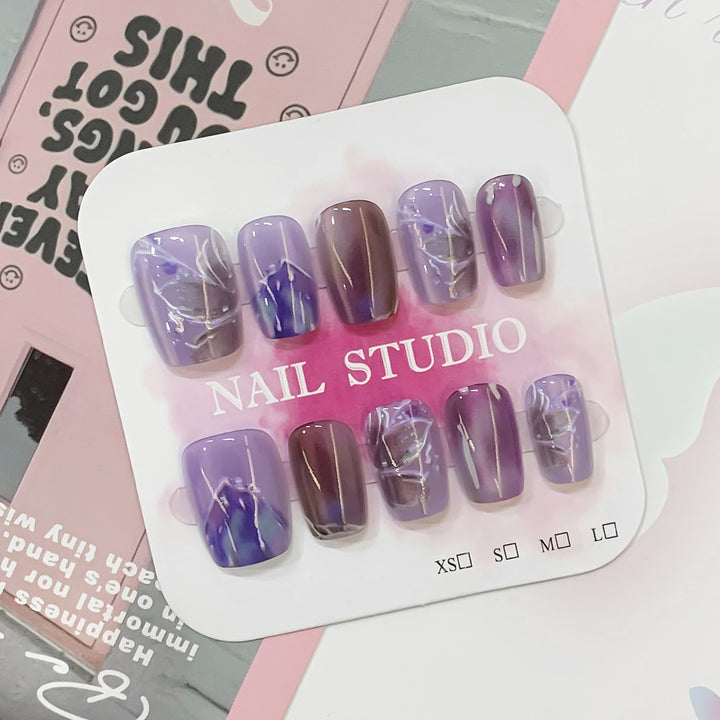 Artful acrylic nails with marbled design Kalsten