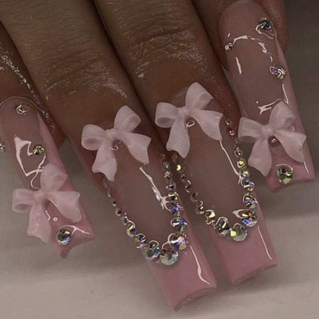 Nail art set with delicate arch decorations and rhinestone details Kalsten