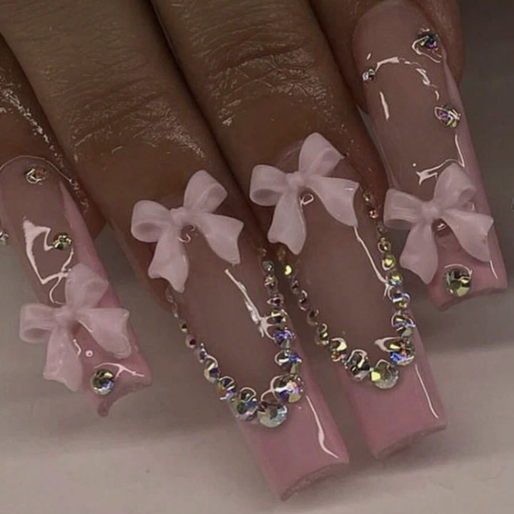 Nail art set with delicate arch decorations and rhinestone details Kalsten