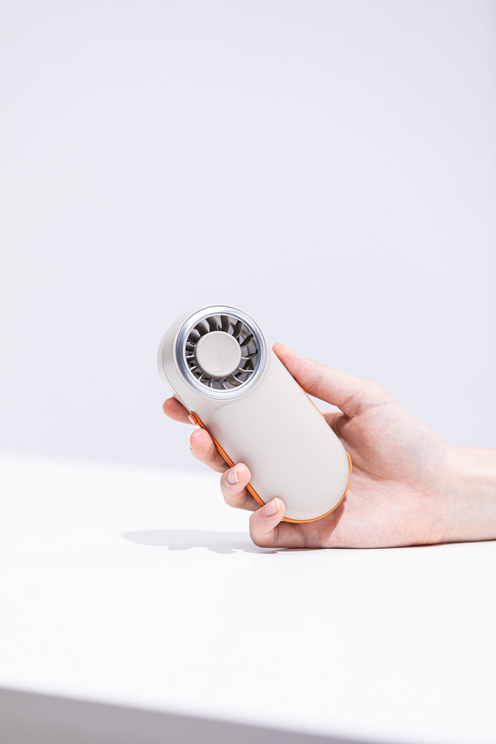 Unisex nan compact rechargeable handheld fan with ergonomic grip and carrying strap Kalsten