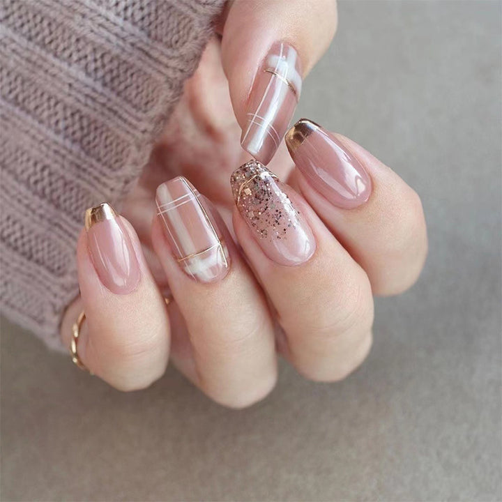 Artistic Nail Extensions with Glitter and Gold Accents Kalsten