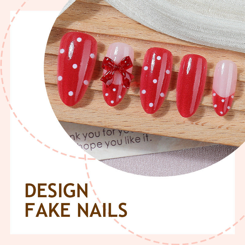 Nail set with playful red polka dots and bow accents Kalsten