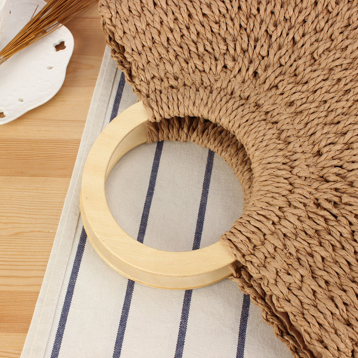 Braided raffia bag with round wooden handles Kalsten