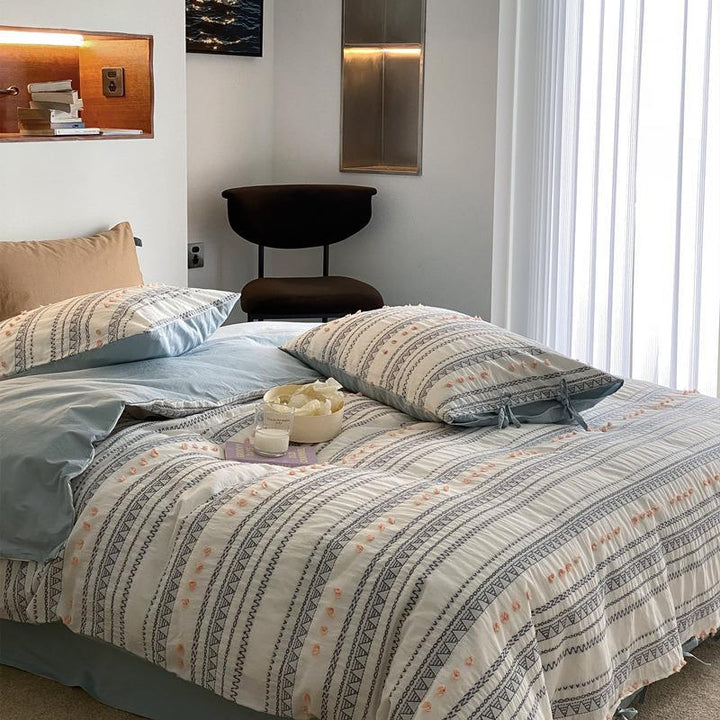 Striped bedding set made of cotton percale with embroidery dots and ties