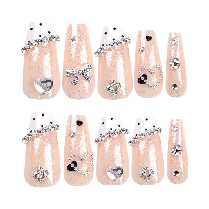 Artful nail extensions with elegant rhinestone and heart designs Kalsten
