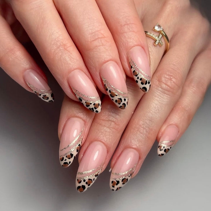 Acrylic nail set with glamorous animal print and elegant accents Kalsten