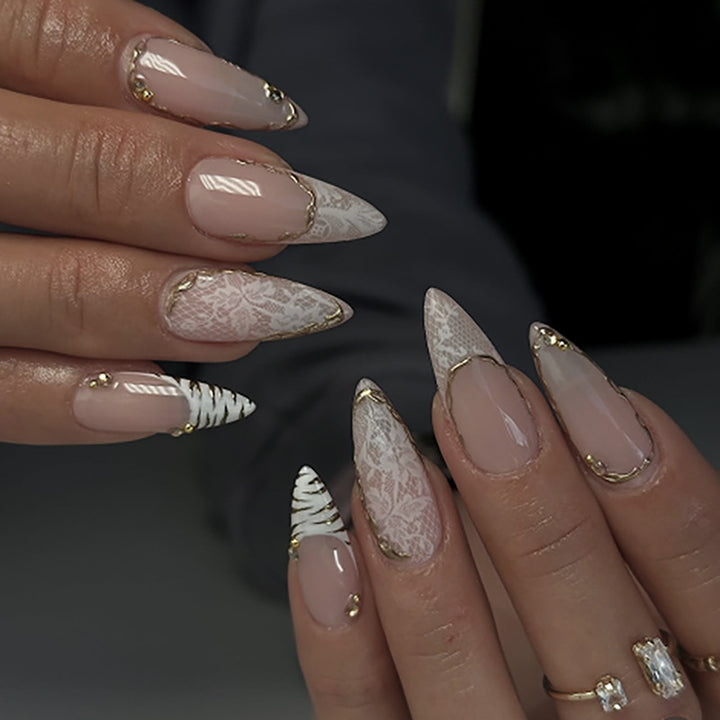 Artful stiletto nails with gold and tip embellishments Kalsten