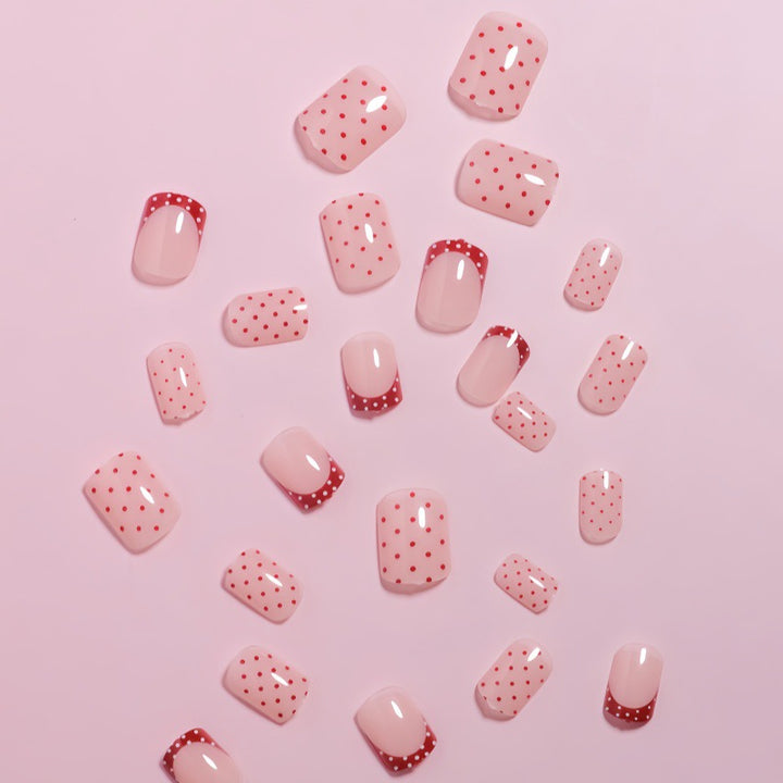Stylish Press-On Nail Design with Polka Dot and French Tip Accents Kalsten