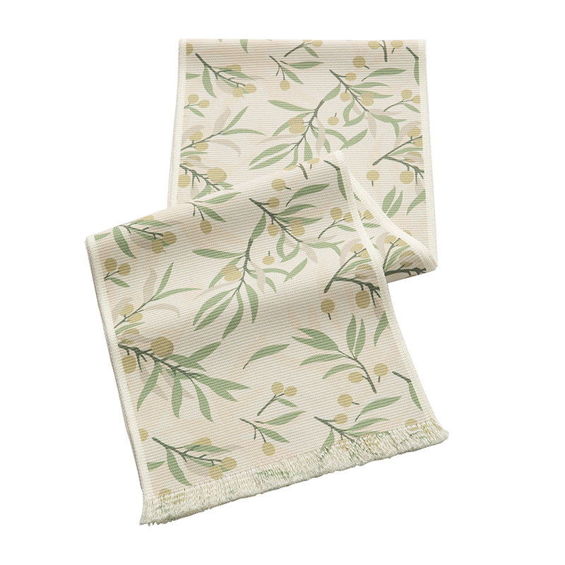Woven table runner with floral jacquard pattern and fringed edge Kalsten