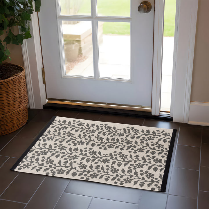 Woven table runner with floral vinyl print look and reinforced overlock stitching Kalsten