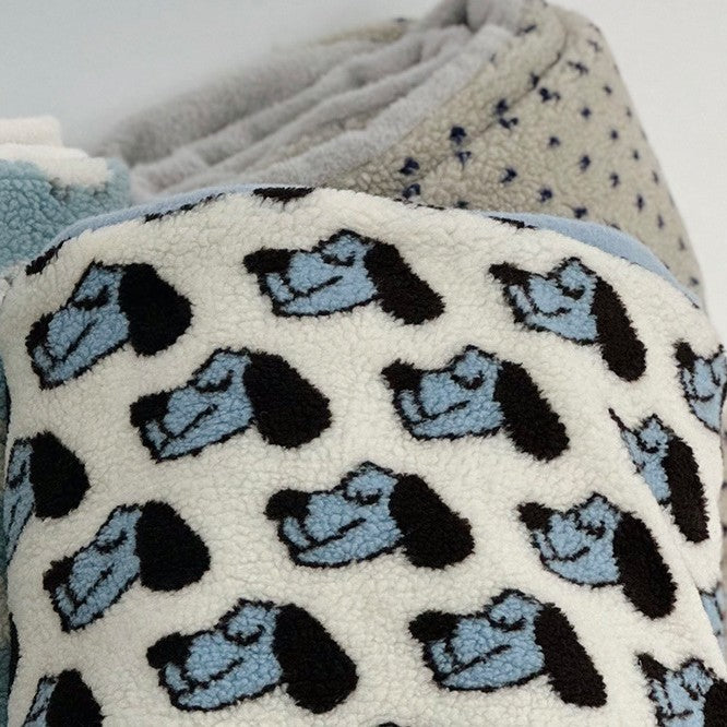 Plush Sherpa throw blanket with abstract pattern and extra-soft teddy fleece