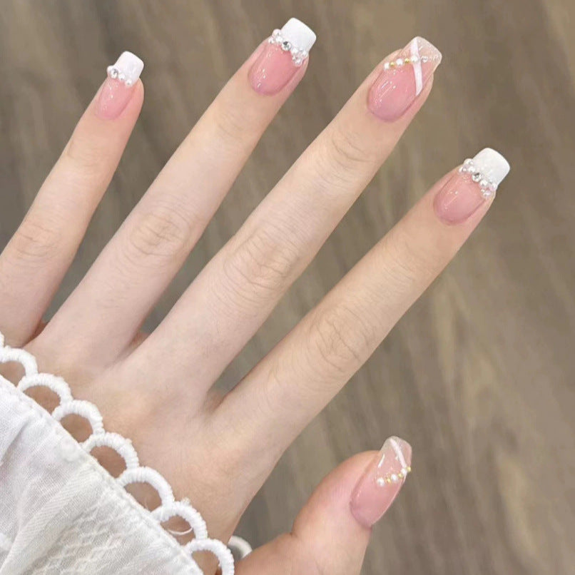 Elegant nail design with pearl embellishment Kalsten