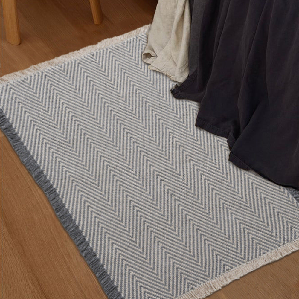 Handwoven cotton bath mat with herringbone pattern and fringes Kalsten