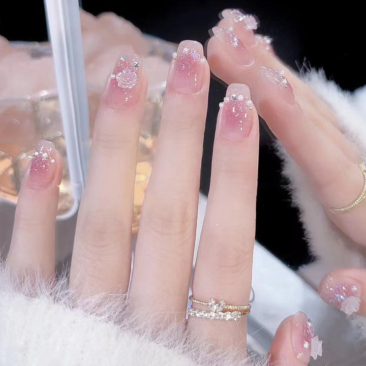 Glamorous nail art with rhinestone and pearl accents Kalsten