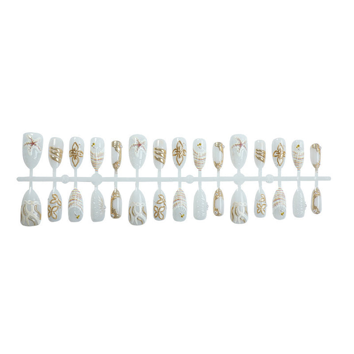 Artificial nail set with luxurious gold embellishments and elegant natural motifs Kalsten