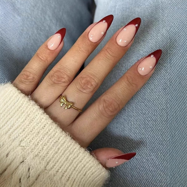 Acrylic nail set with elegant spike design and shimmering accents Kalsten