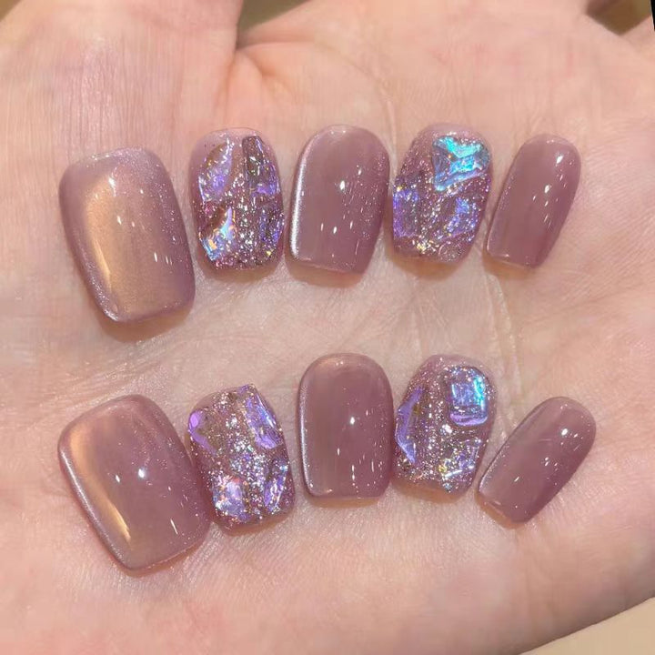 Acrylic nails with glitter accents and modern designs Kalsten