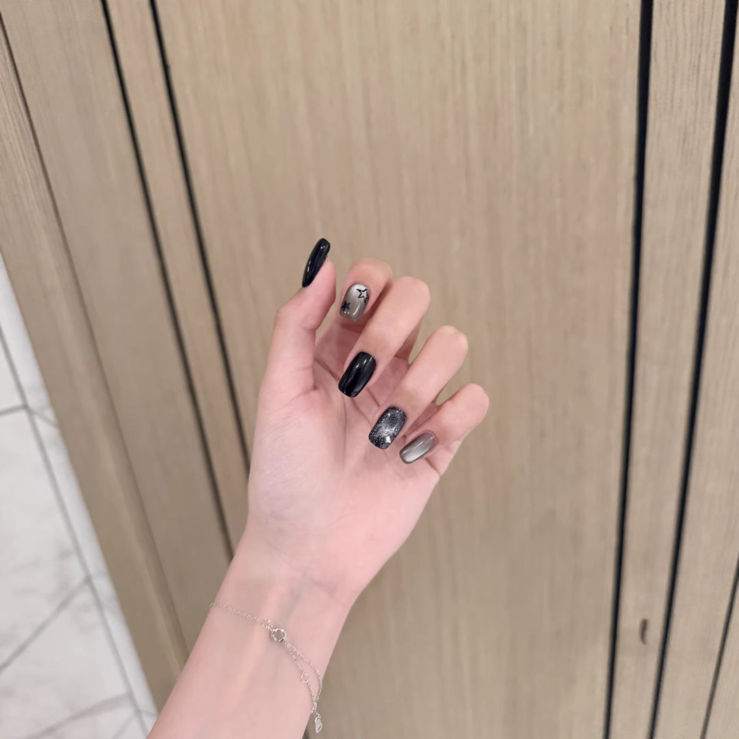 Artistic Press-On Nail Design with Metallic Accents