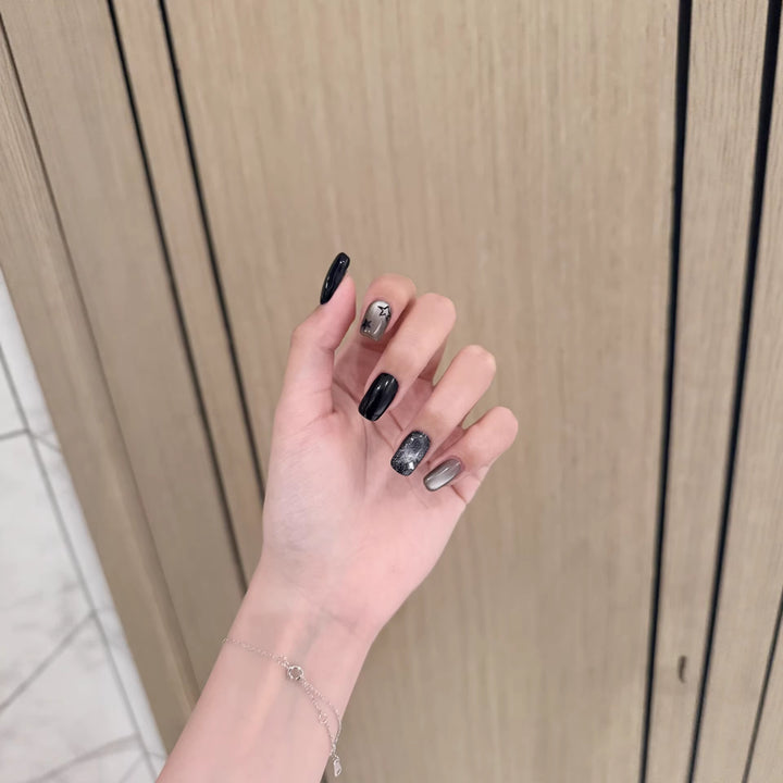 Artistic Press-On Nail Design with Metallic Accents