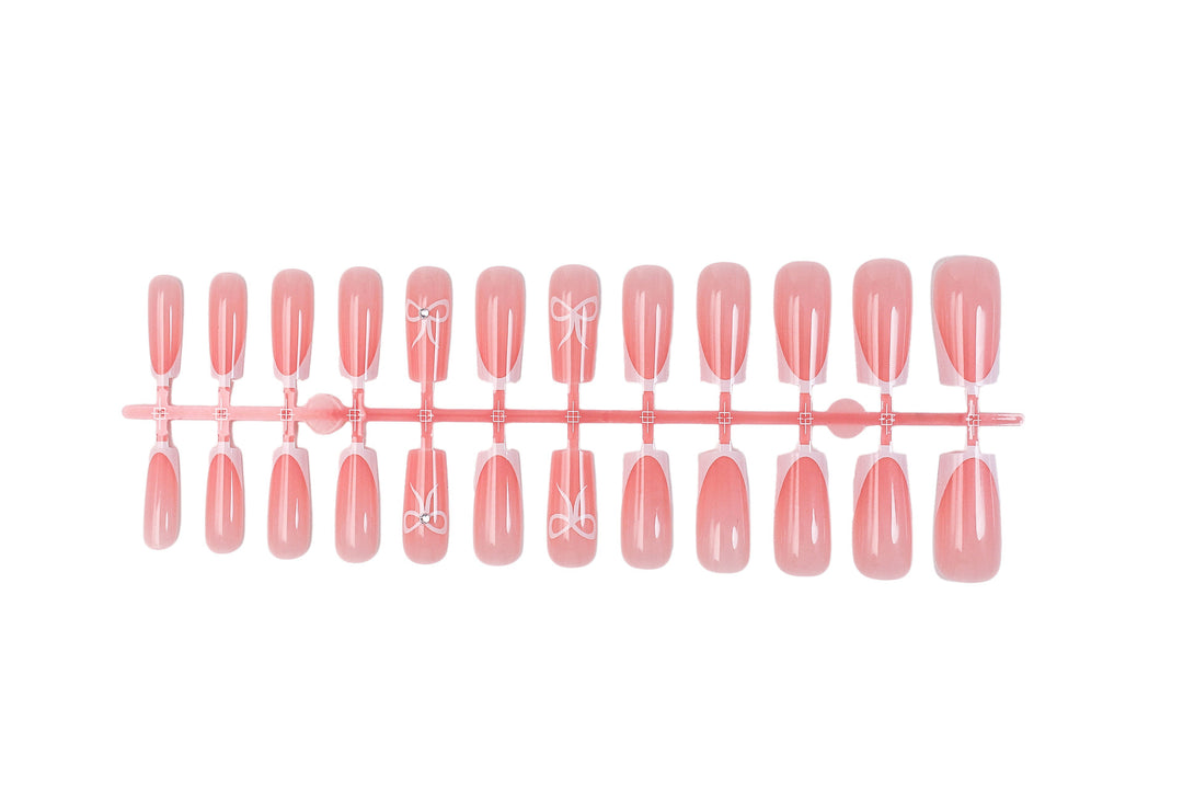 Artificial nail set with elegant tips and delicate bow motifs Kalsten