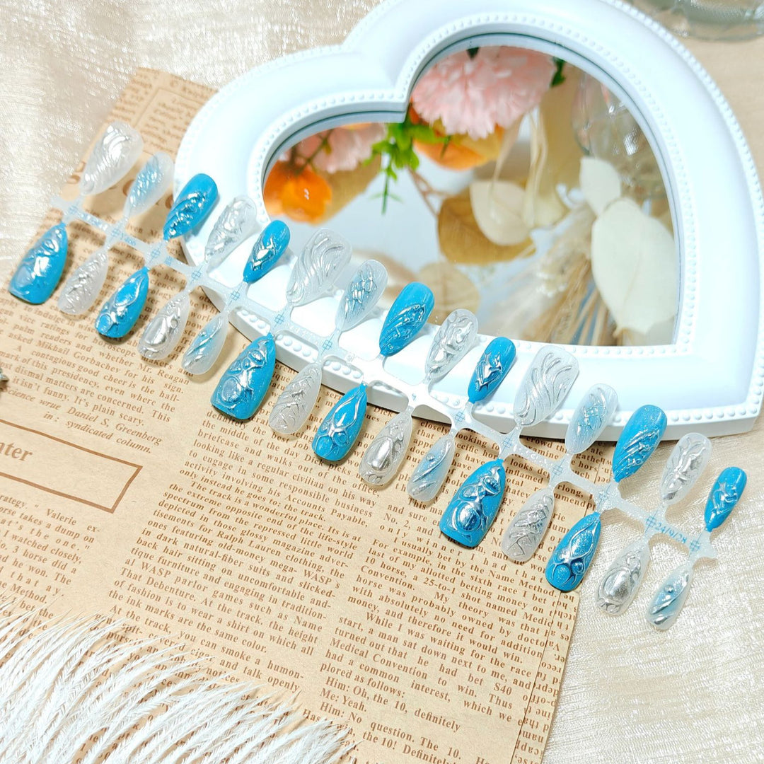 Creative artificial nails with shiny silver and turquoise tones Kalsten