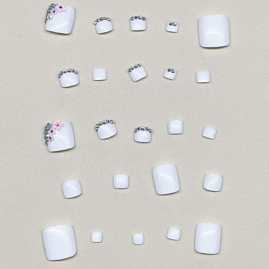 Nail art set with elegant glitter embellishments and floral accents Kalsten