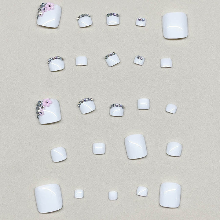 Nail art set with elegant glitter embellishments and floral accents Kalsten