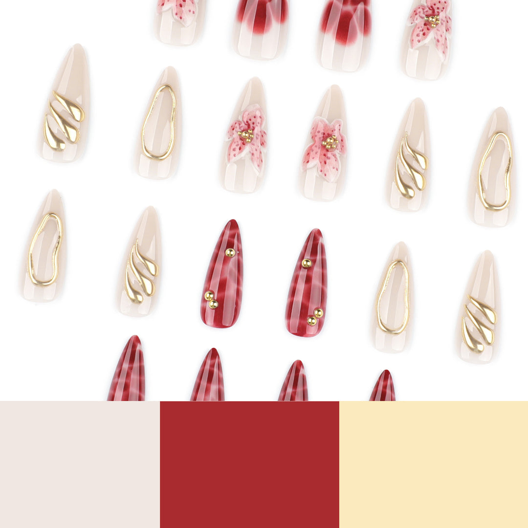 Artful stiletto nails with elegant floral designs and glitter accents Kalsten