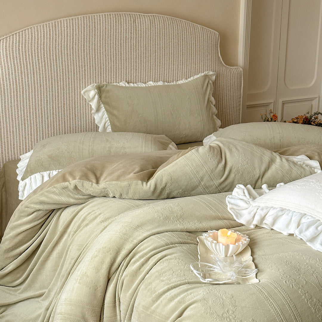 Quilted bedding set with ruffle and medallion relief