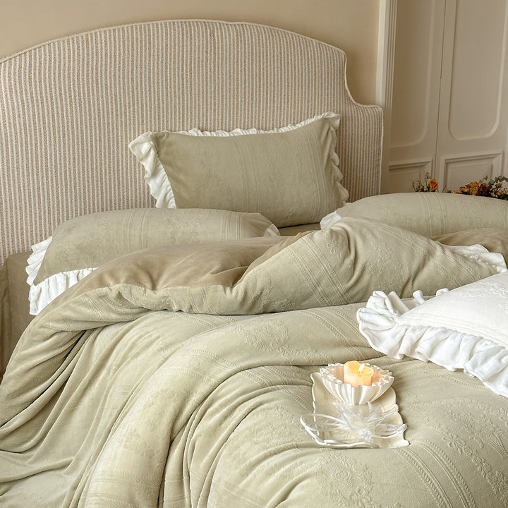 Quilted bedding set with ruffle and medallion relief