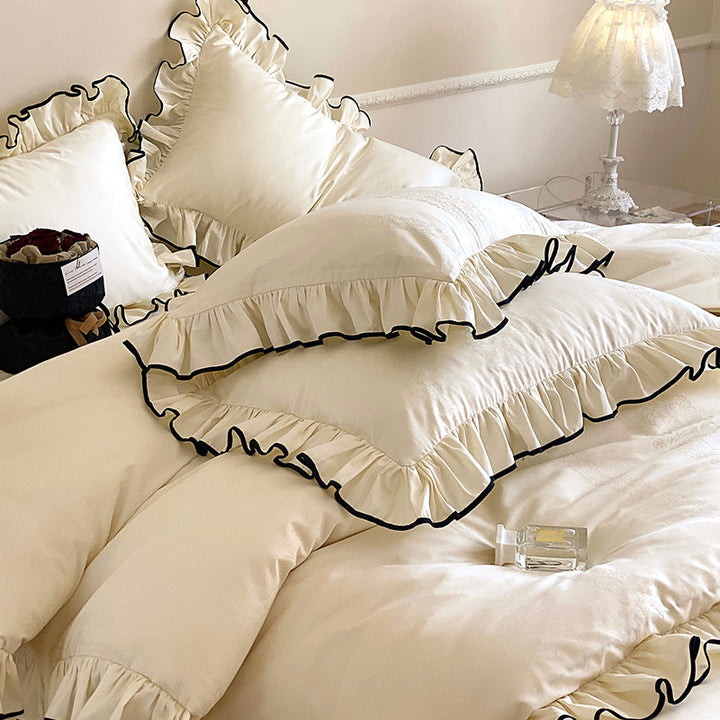 Noble cotton satin bedding set with flounce ruffles, jacquard floral border and contrasting piping.