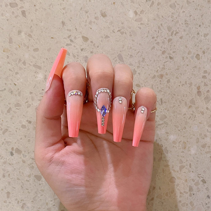 Artificial nails with glitter and stone embellishments Kalsten