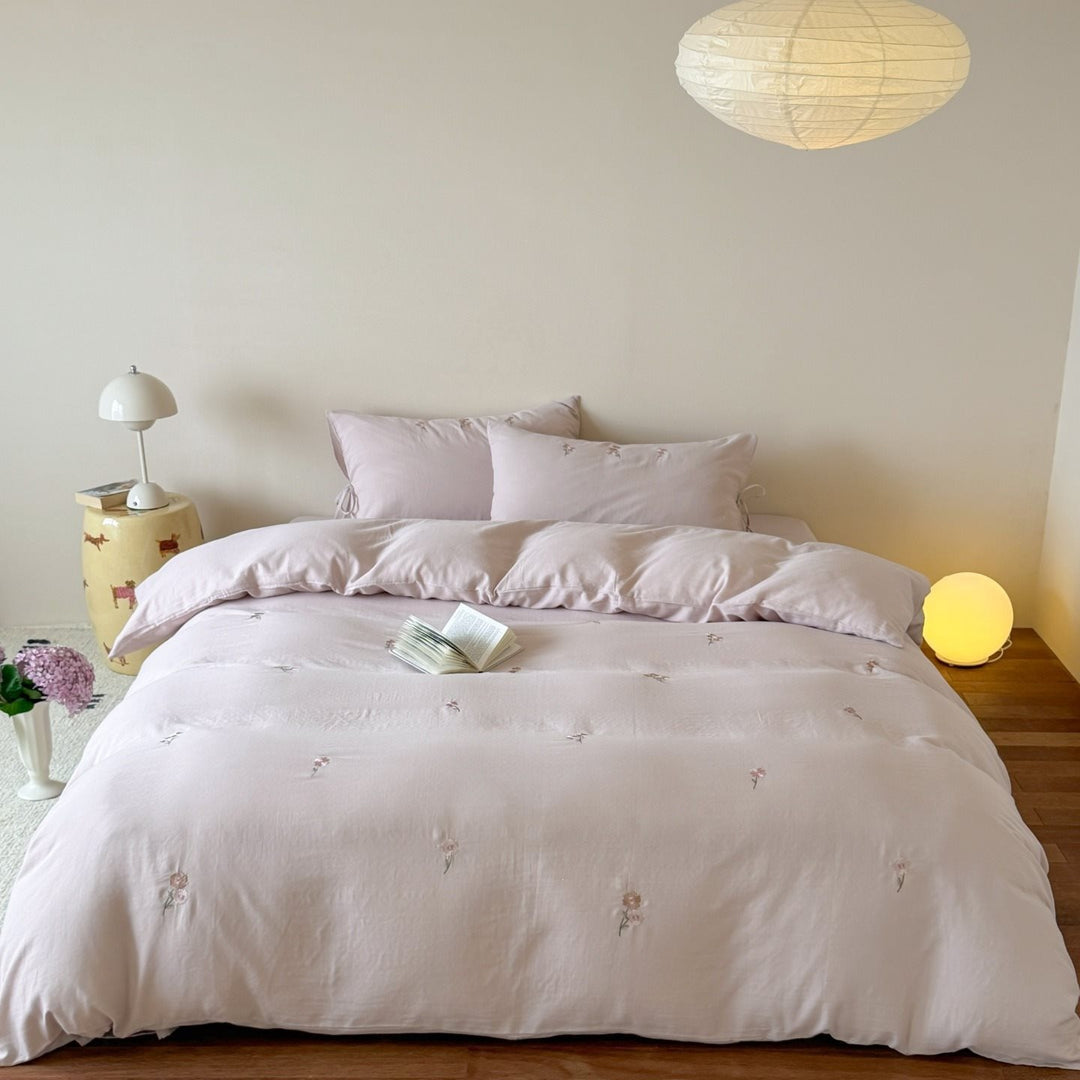 Embroidered cotton bedding set with delicate floral embroidery and tie bands