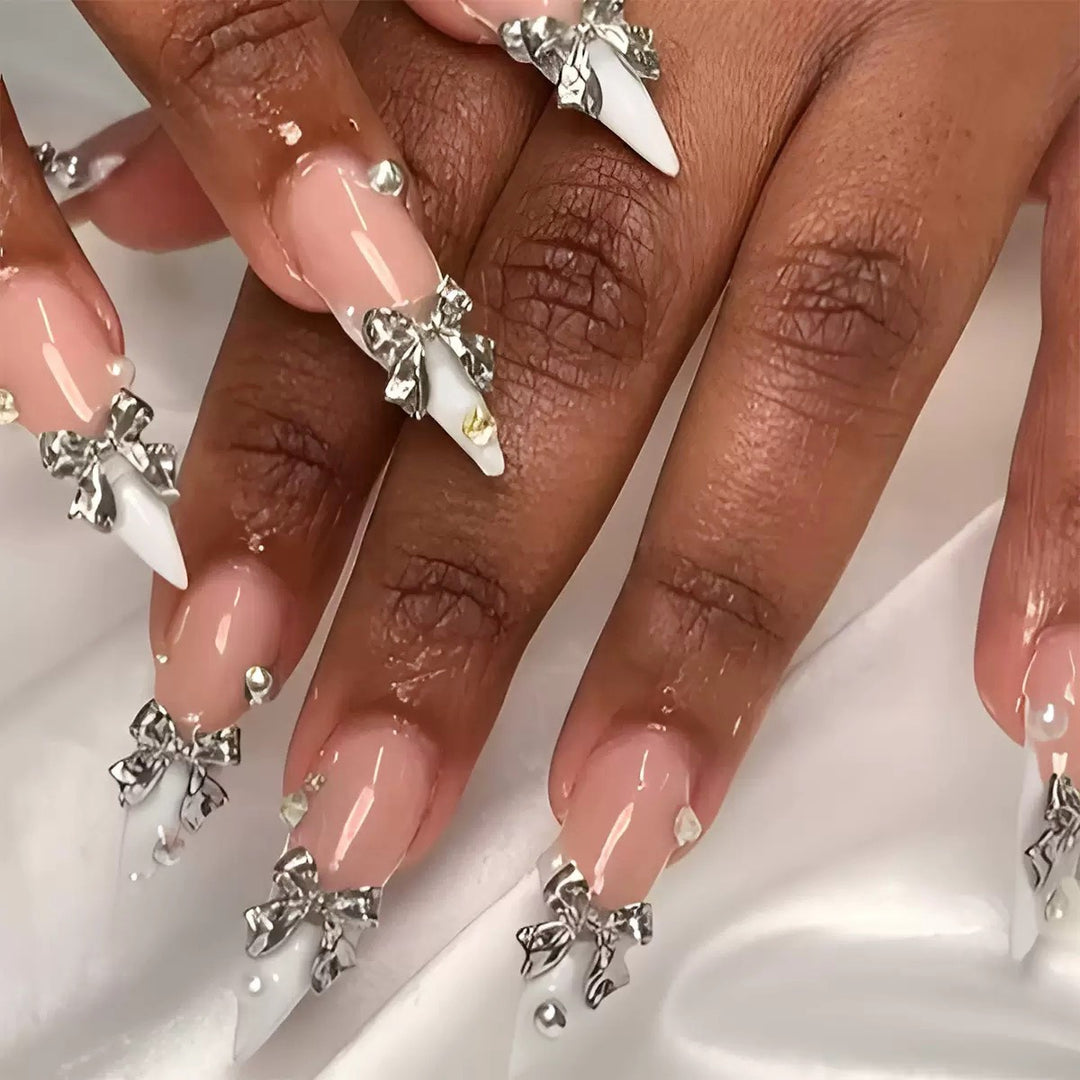 Acrylic nail set with elegant bows and sparkling accents Kalsten