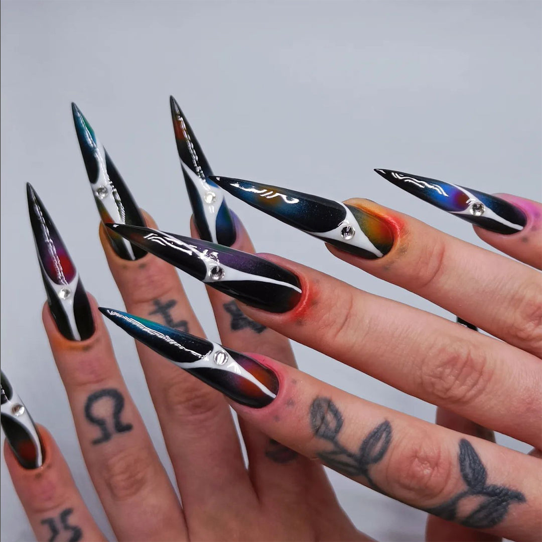 Artful stiletto nails with sparkling accents and geometric design Kalsten