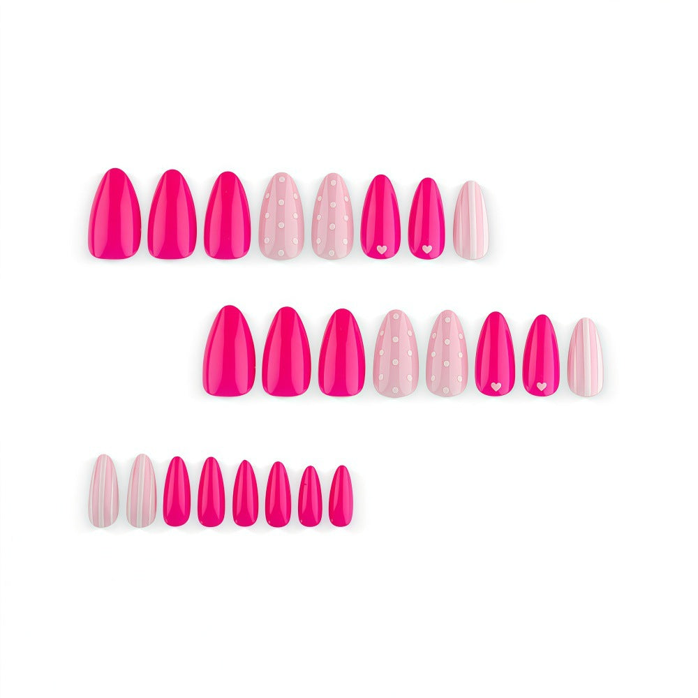 Artificial nails in playful design with hearts and dots Kalsten