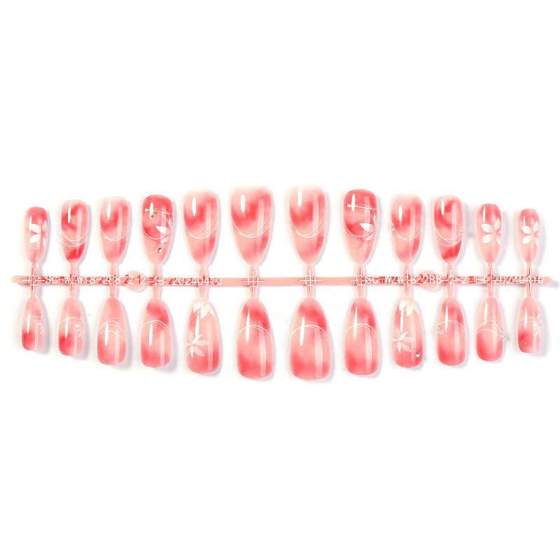 Acrylic nail set with elegant ombre design and floral accent Kalsten