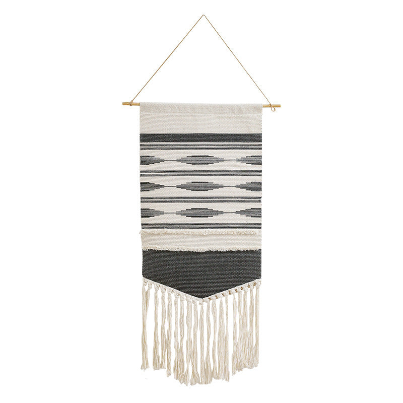 Handwoven wall hanging made of cotton blend with layered textures, wood rod and long fringes Kalsten