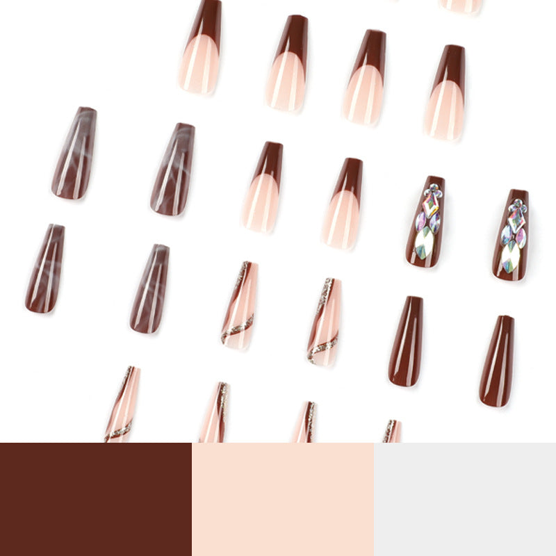 Artificial nail extensions with elegant gemstone embellishments Kalsten