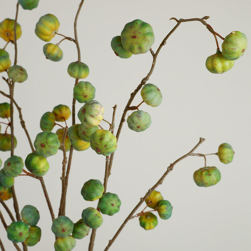 Artificial decorative branch with dried-looking pumpkin balls and flexible wire stem
