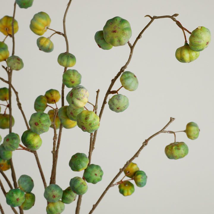 Artificial decorative branch with dried-looking pumpkin balls and flexible wire stem