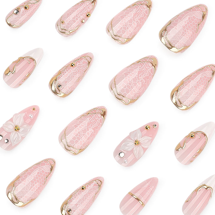 Artful nail extensions with delicate flower and gold embellishments Kalsten
