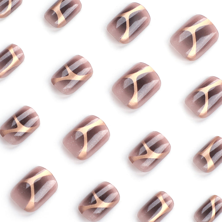Artificial nail art with elegant metallic design and glitter accents Kalsten