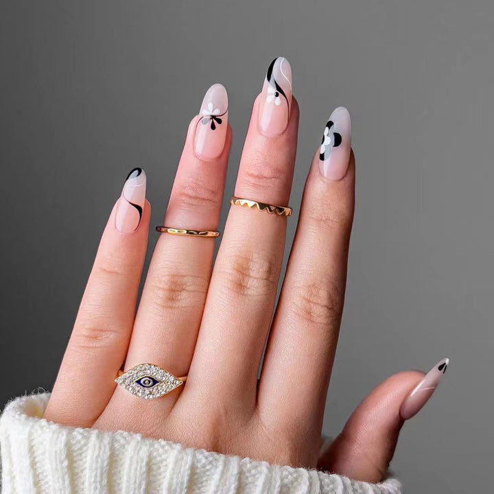 Artful nail extensions with an elegant leaf pattern Kalsten