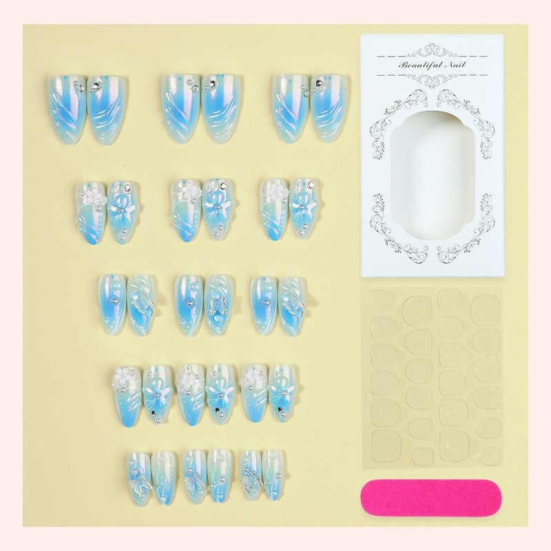 Artificial nail creation with floral designs and glitter accents Kalsten