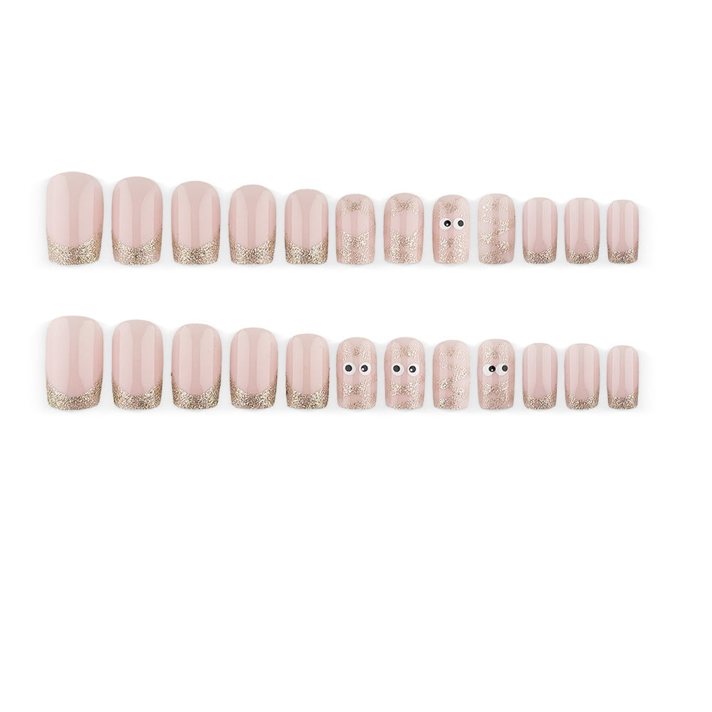 Artificials nails with playful eye design and glitter tips Kalsten