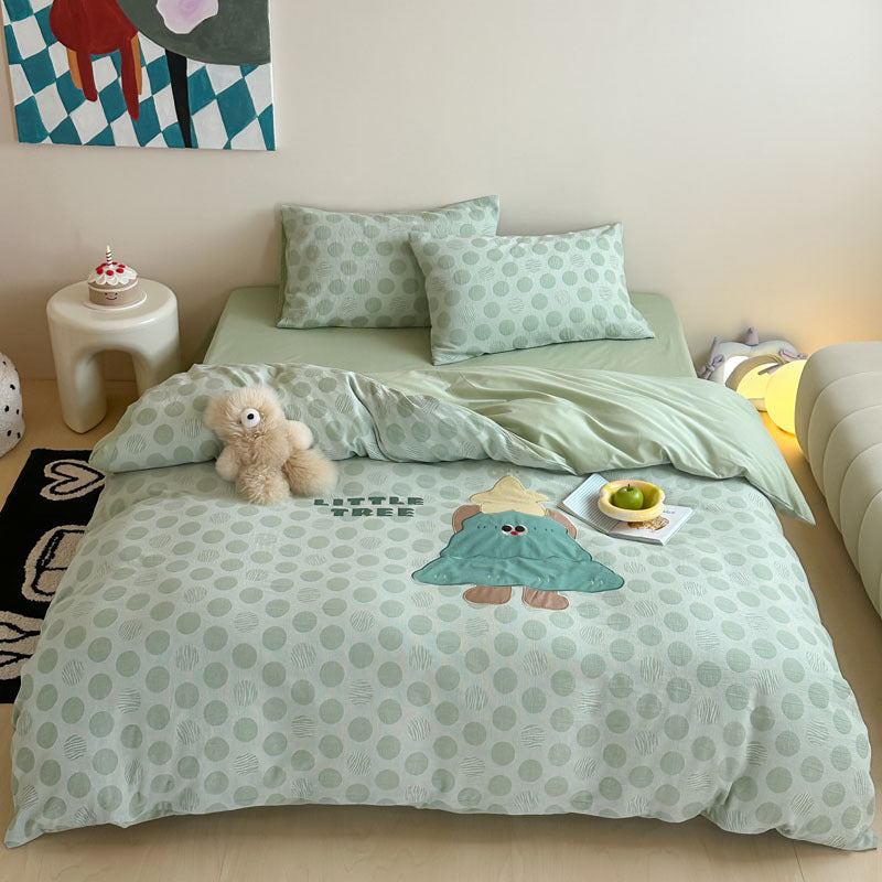 Child-friendly bedding set with embroidered rabbit motif and dotted woven texture