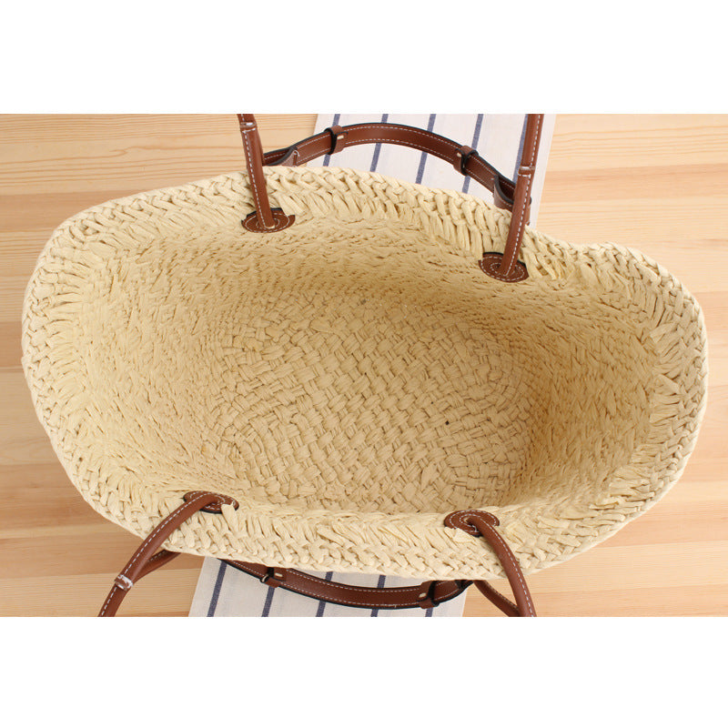 Beach bag made of handcrafted natural material with sturdy leather handle Kalsten